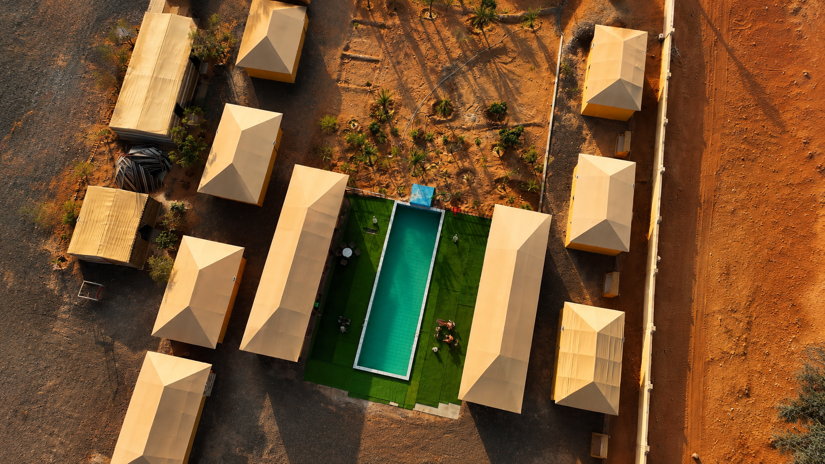 Sand Camp Oman — aerial drone view of resort with pool in Bidiyah desert, Wahiba Sands